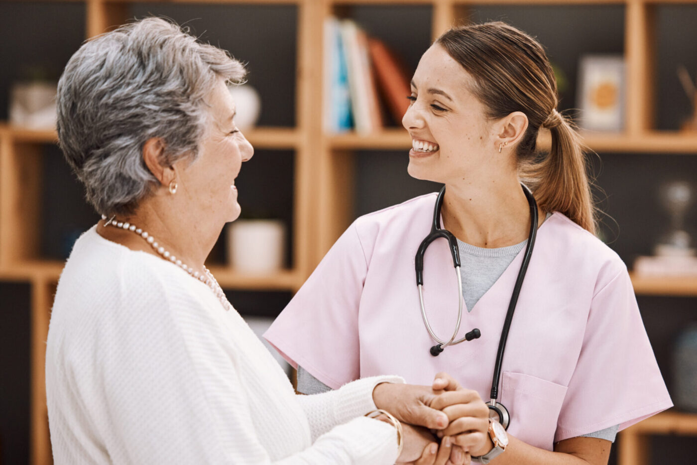 A medical provider speaking with a patient in a supportive clinical setting