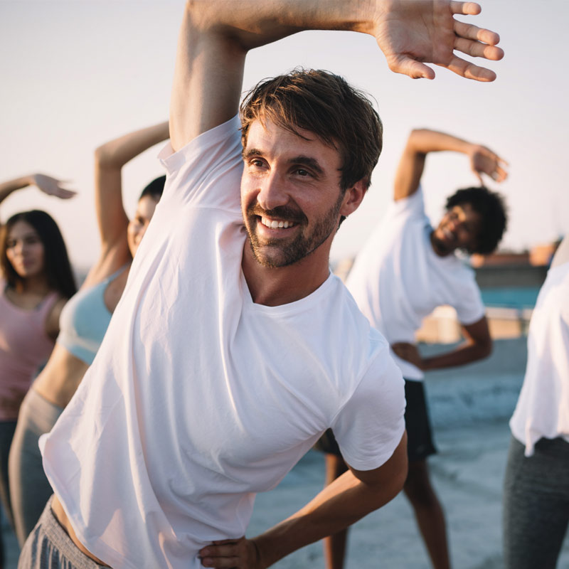 Fitness, sport, friendship and healthy lifestyle concept . Group of happy people exercising